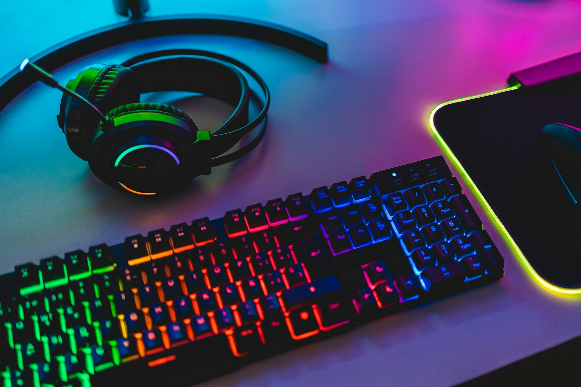 Gear equipment at gamer workspace - Rgb, keyboard, headphones and mouse